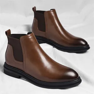 Classic men's brown leather Chelsea boots with elastic side panels and durable soles.