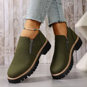 Stylish olive green round toe ankle boots featuring side zipper and chunky sole