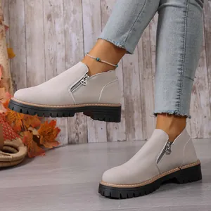 Grey suede round toe ankle boots with side zipper and chunky lug sole