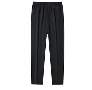 Detailed front view of men's fleece-lined black casual trousers with elastic waistband