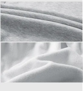 Detailed view of grey jersey fabric and soft white fleece lining for thermal pants