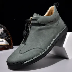 Stylish men's grey suede casual loafers featuring a front zipper and toggle closure