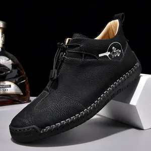 Men's black leather slip-on loafers with hand-stitched detailing and toggle closure