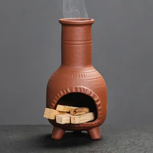 Vintage terracotta mini chiminea incense burner with palo santo wood sticks for home decor