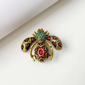 Vintage insect bee brooch pin with colorful rhinestones and black enamel detail
