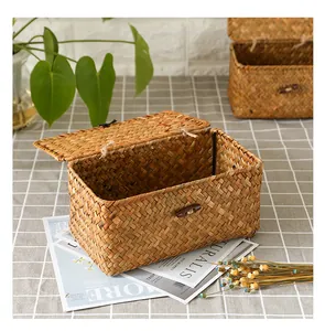 Detail showing the natural texture of a seagrass woven storage box with a flip-top lid