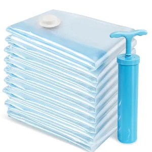 Stack of blue vacuum storage bags with manual hand pump for home clothing organization