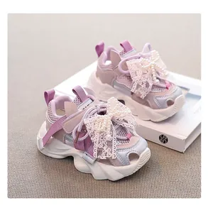 Detailed view of purple girls' breathable mesh sneakers featuring a decorative pearl lace bow