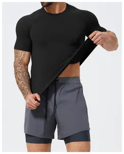 Close-up of men's black seamless athletic t-shirt showing high fabric elasticity.
