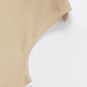 Close-up of the stitching and armhole detail on a khaki quick-dry athletic vest.
