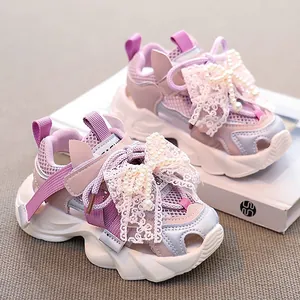 Trendy girls' summer mesh sports sandals featuring elegant lace bows and pearl details