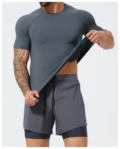 Close-up showing the stretch and seamless mesh texture of the charcoal sports T-shirt