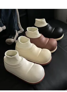 Detailansicht der warmen, wattierten Winterschuhe für Kinder in modernen Neutraltönen
