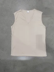 Detailed view of the neckline and fabric of this beige V-neck breathable men's vest