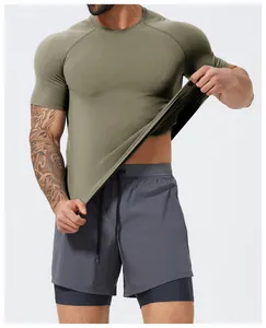 Close-up of breathable olive green seamless quick-dry compression shirt for men's gym wear