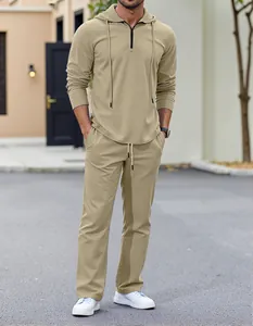 Full body shot of a men's khaki textured hooded long sleeve lounge set on a model