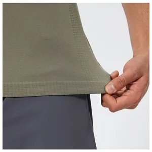 Close-up detail of olive green seamless athletic t-shirt showing breathable fabric texture