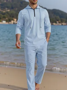 Men's light blue casual linen two-piece set with hooded zip-up top and trousers