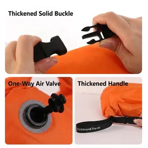 Détails du sac de rangement orange : boucle robuste et valve d'air unidirectionnelle.