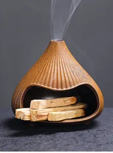 Ceramic Mt. Fuji incense burner fireplace design with Palo Santo sticks and smoke