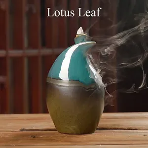 Ceramic backflow incense burner with lotus leaf design and blue gradient finish.