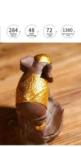 Macro detail of golden harness on purple clay elephant backflow incense burner.