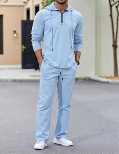 Detail view of men's light blue casual linen-style hooded zip-up and trousers set.