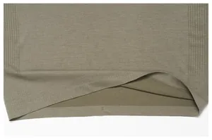 Detail view of quick-dry seamless fabric and hem on olive green sports t-shirt