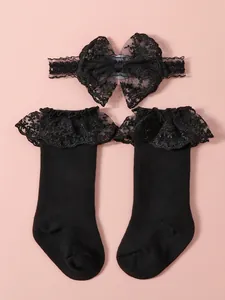 Conjunto Lolita para bebé con diadema de lazo de encaje negro y calcetines con volantes