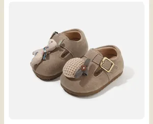 Close-up of soft-sole baby walking shoes with cute plush and knit decorations