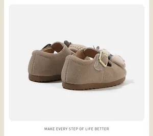 Detailed back view of khaki suede baby walking shoes featuring soft soles and buckles