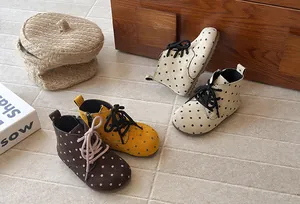 Detailed visual view of polka dot pattern children's Martin boots in multiple colors.