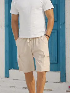 Close-up of beige corduroy cargo shorts with drawstring and side pockets