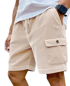 Close-up of men's beige corduroy cargo shorts with drawstring and button pocket detail.