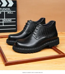 Detailed macro shot of men's black leather Martin boots with embossed crocodile texture