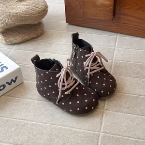 Brown polka dot boots for girls with soft soles and pink laces