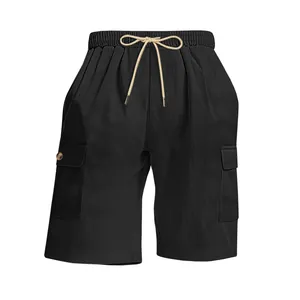 Macro detail of black corduroy cargo shorts with elastic drawstring waist and pockets