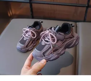 Detailed view of breathable purple mesh chunky sneakers for girls, stylish kids' shoes.