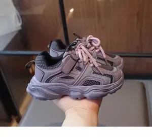 Detailed view of girls' purple mesh sneakers featuring pink laces and breathable design