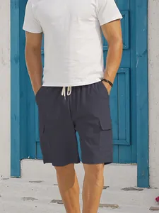 Close-up of men's dark grey corduroy cargo shorts with drawstring and side pockets