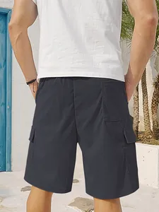 Back view of dark gray corduroy cargo shorts with multi-pocket design for men