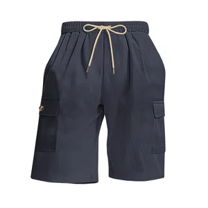 Macro view of navy blue corduroy fabric on men's cargo shorts with drawstring waist