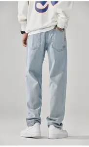 High-quality back view of men's loose straight-leg light blue washed denim jeans.
