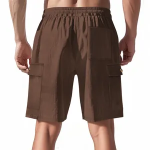 Back view of men's brown corduroy cargo shorts with pocket details and texture