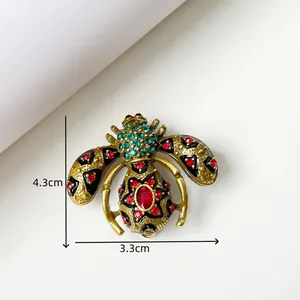 Vintage bee brooch detail showing dimensions 4.3cm by 3.3cm with colorful rhinestones