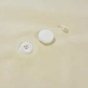 Detail of vacuum storage bag air valve for space-saving clothes organization