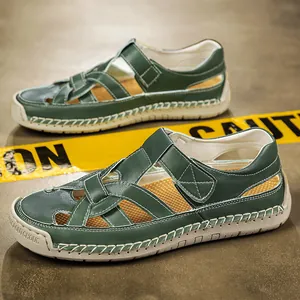 Green leather-look closed-toe sandals with white contrast stitching and soft rubber soles