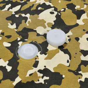 Close-up of camouflage Oxford cloth vacuum storage bag with durable white compression valve