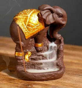 Detailed close-up of an elephant backflow incense burner showing artistic smoke effect