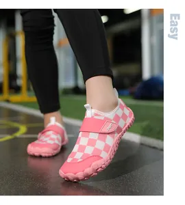 Close-up of pink checkered kids' water shoes with non-slip soft sole